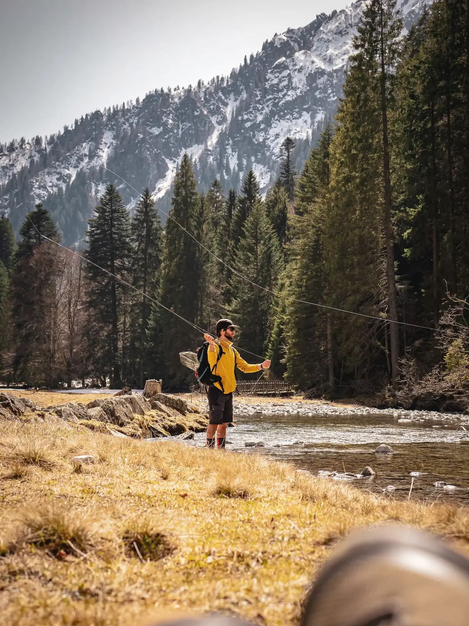 Local fishing guide casting river