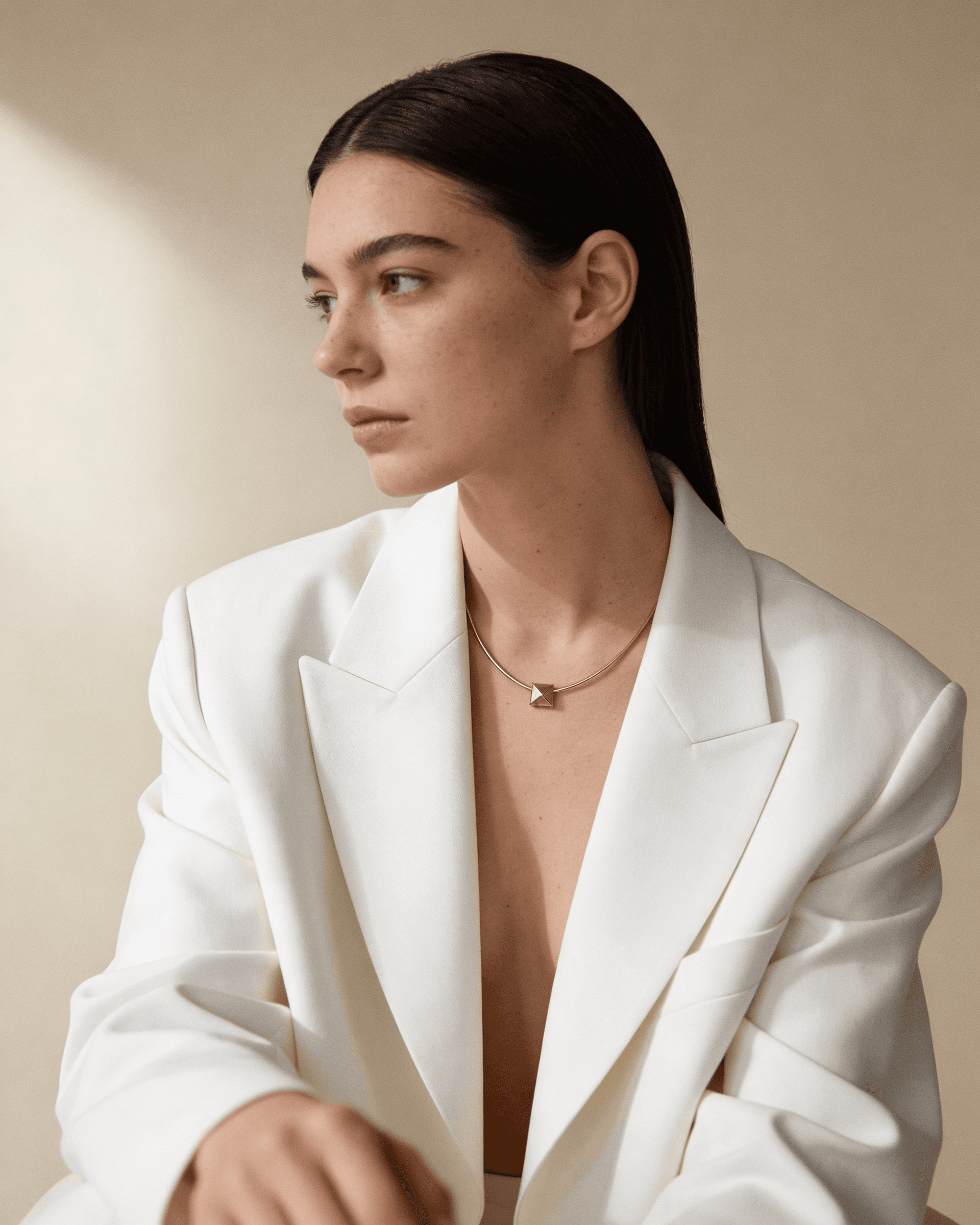 Gilr with freckles pausing while looking towards camera