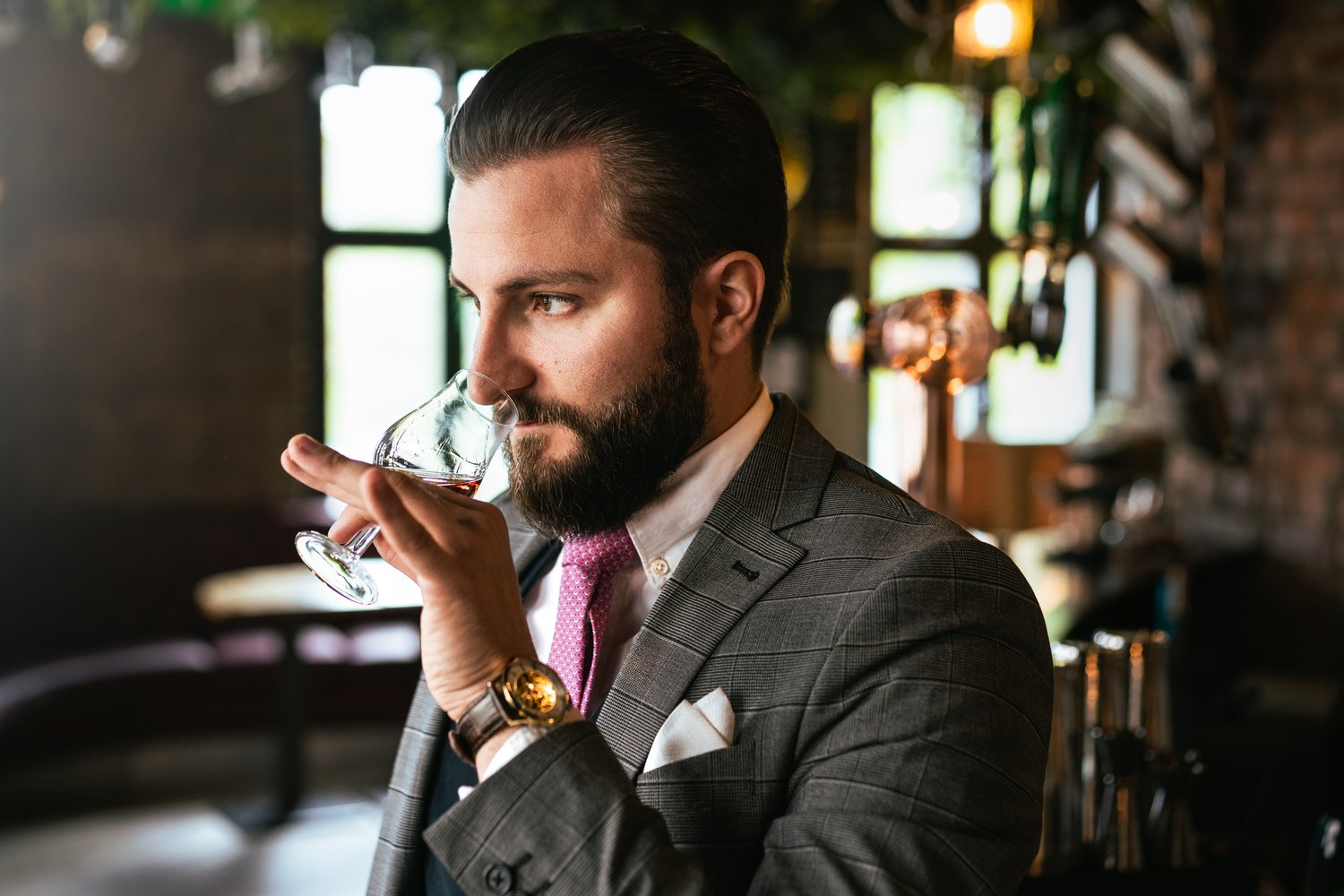 Sommelier sniffing liquid from the glass