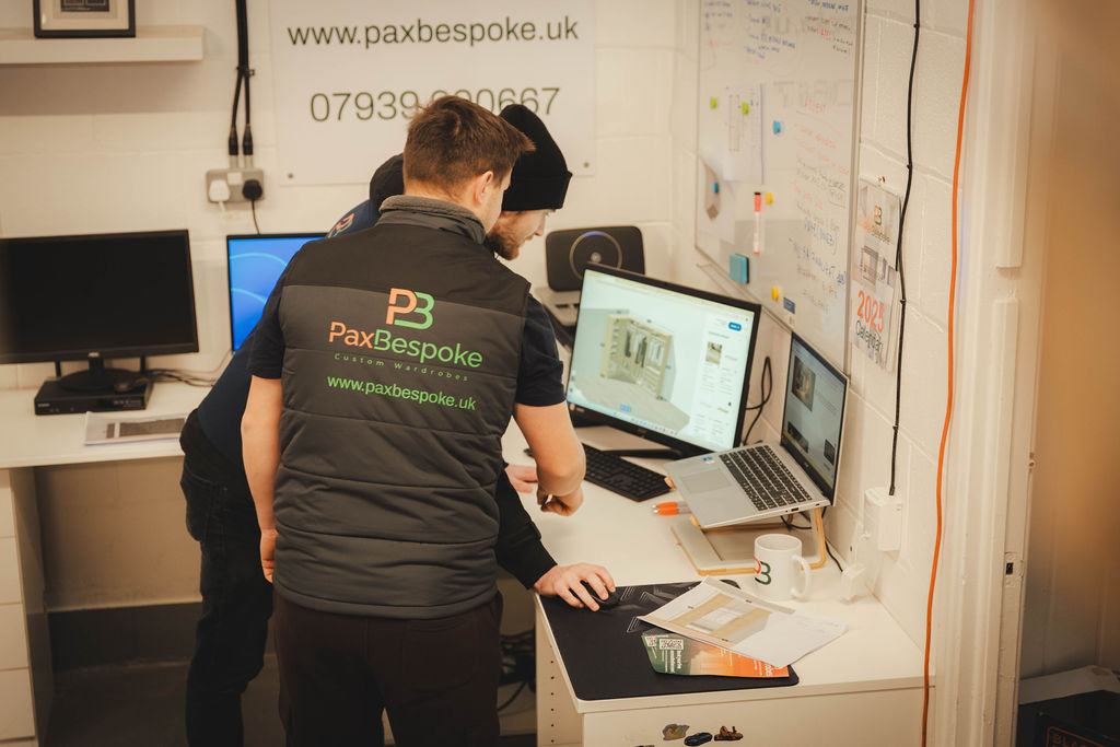 two men looking at a computer screen