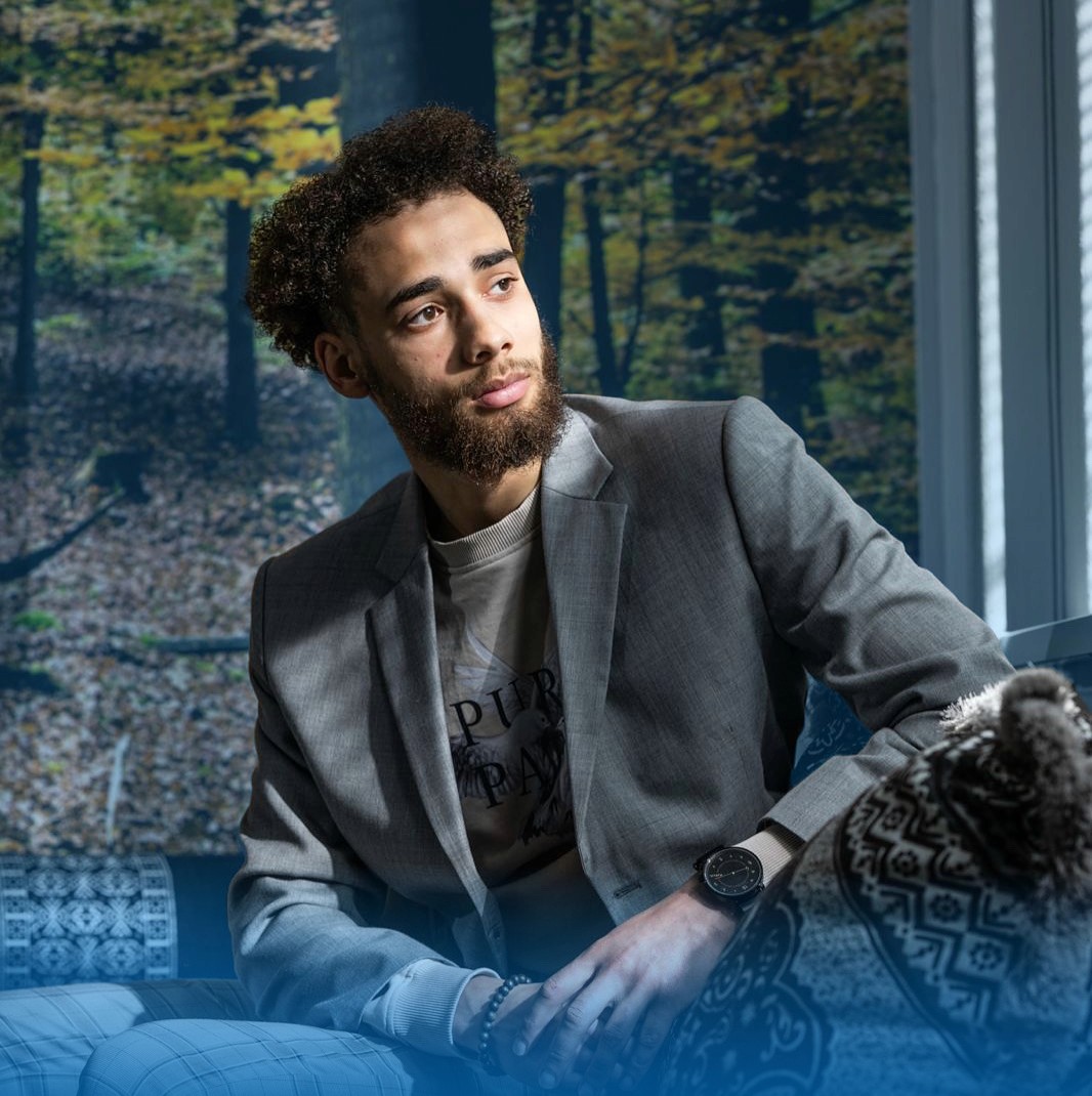 Artistic portrait with red and blue lighting creating a dramatic effect