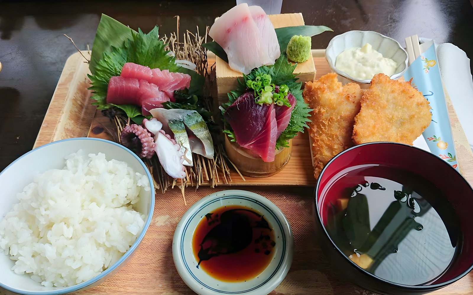 Traditional Japanese meal with sashimi, rice, miso soup, and fried fish on Okinawa Hip Hop Bus Tour C Course.