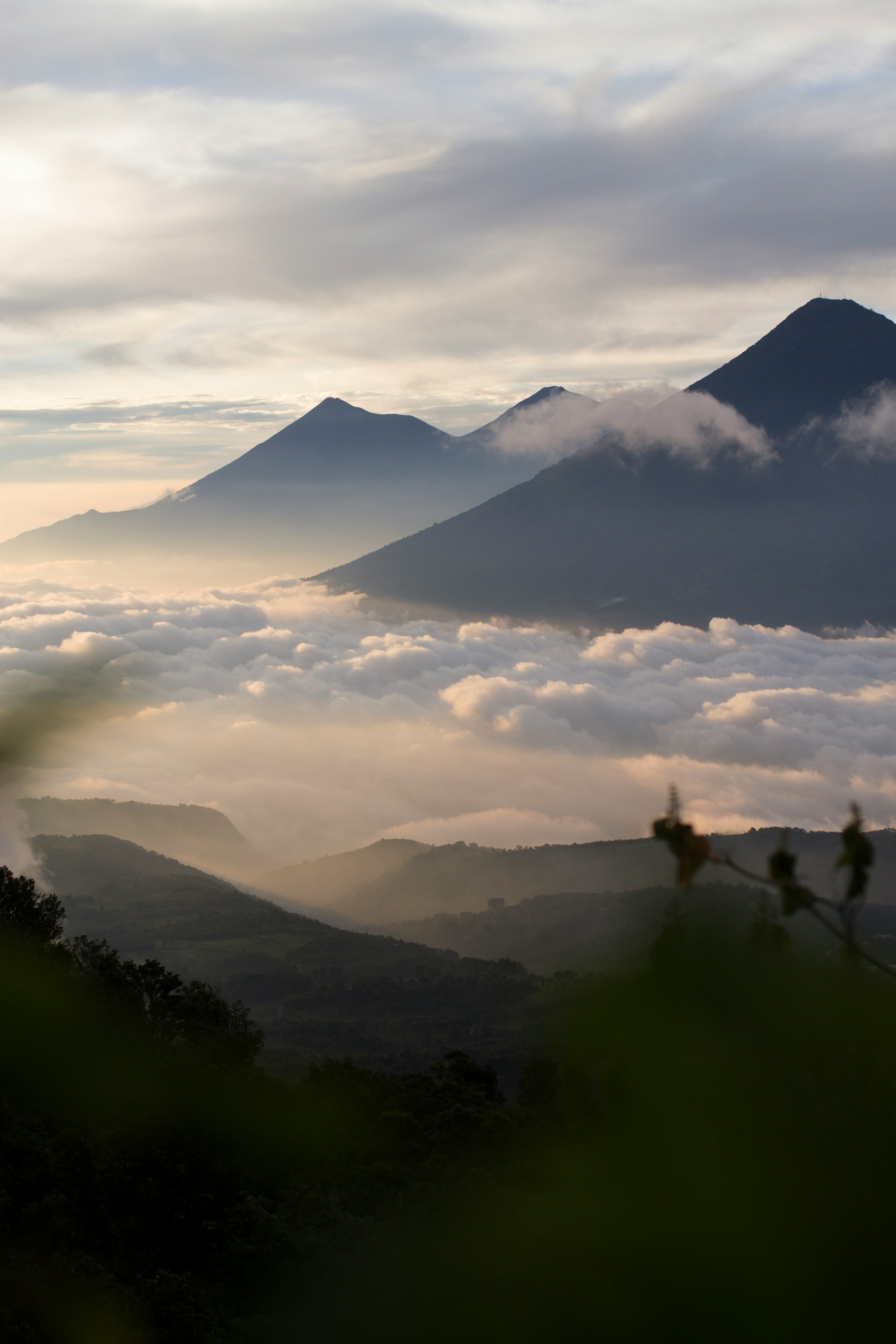 mountains under cloudy sky during daytime