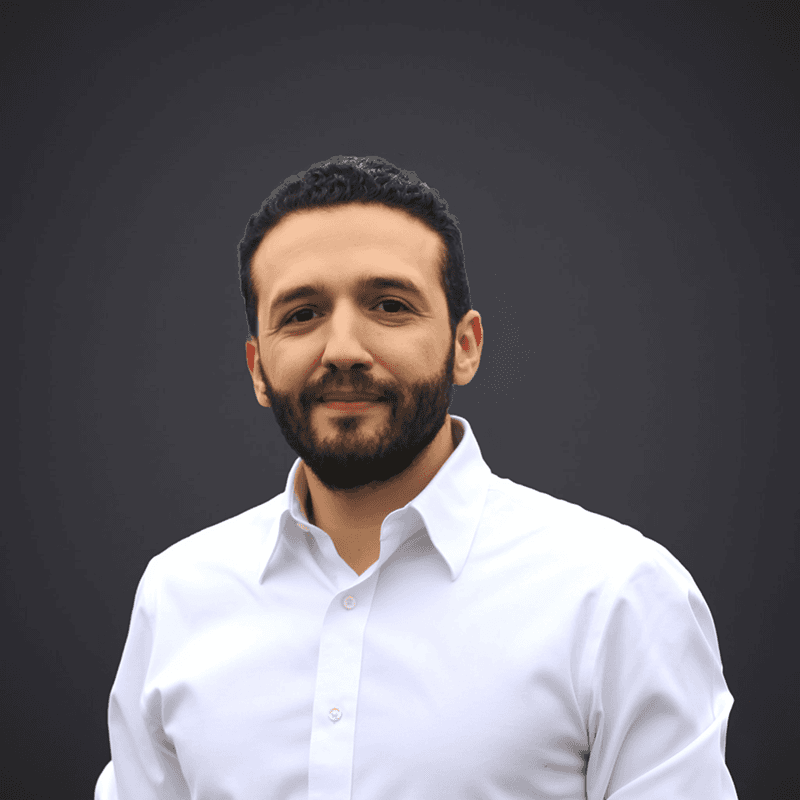 a young man wearing a hat and a t - shirt