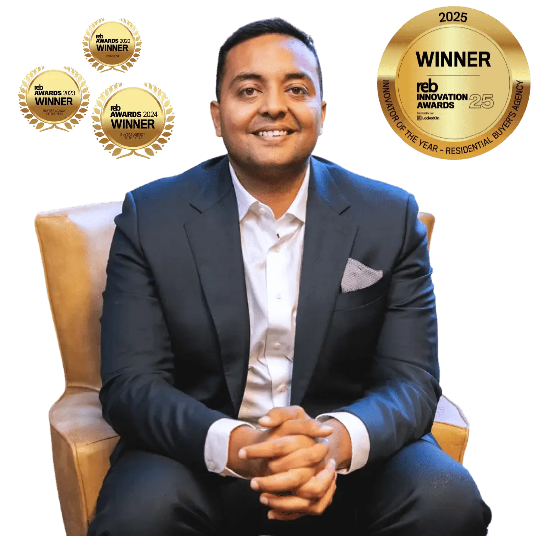 Man in suit with award badges.