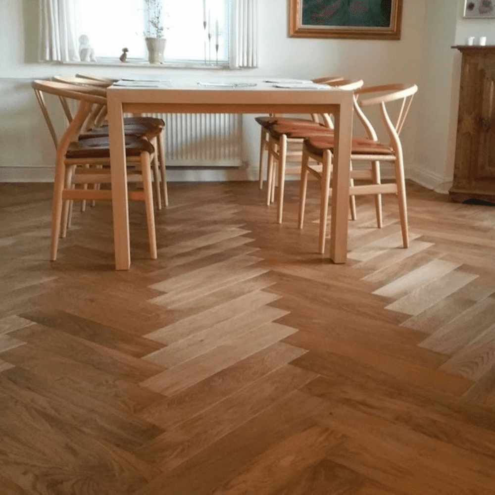 a man in a hard hat and safety gear working on a wooden structure