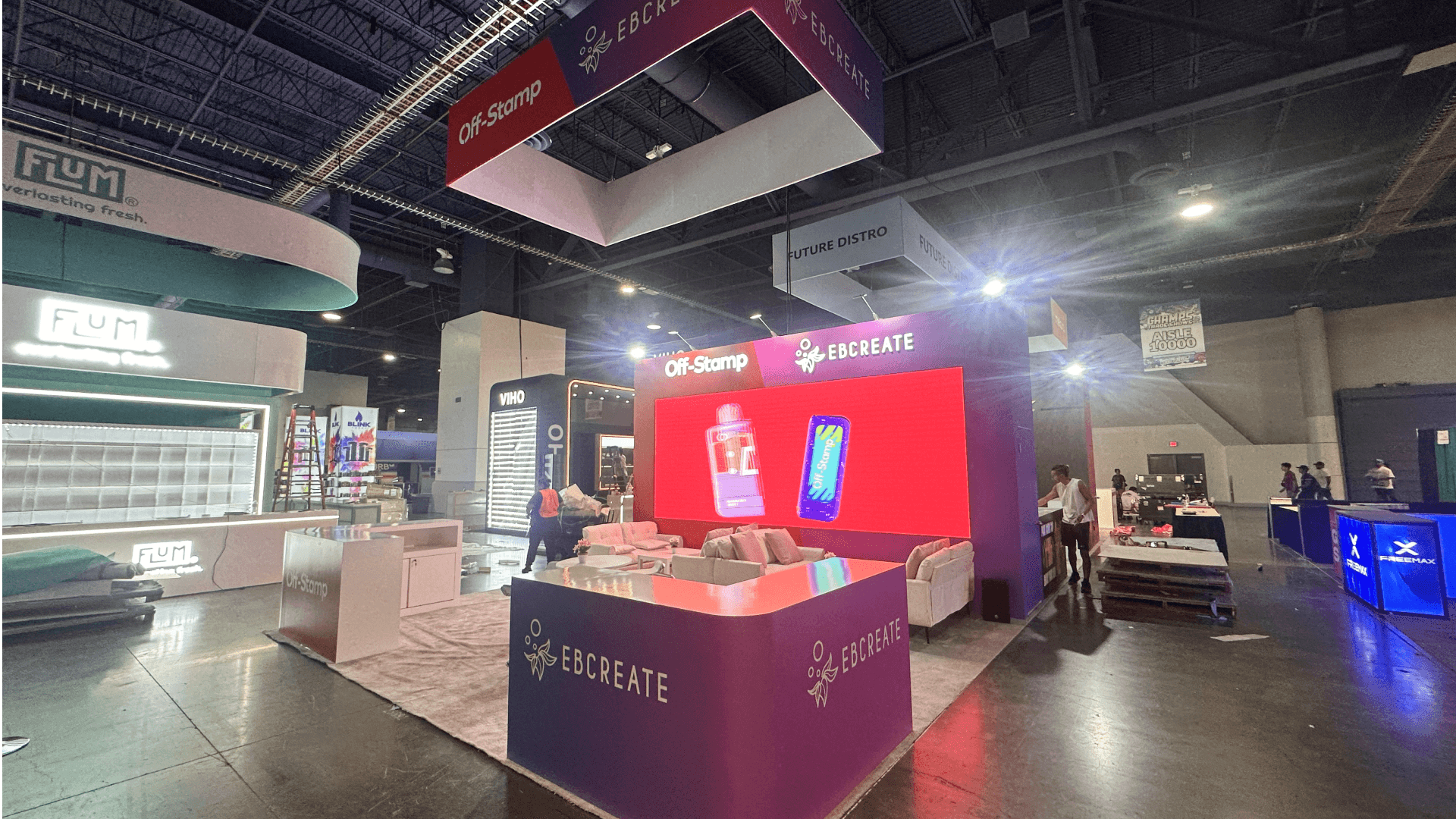 Geekbar CHAMPS Las Vegas 2025 20x60 booth at LVCC – overhead cube rigging and aisle-facing brand visibility for disposable vape demos.