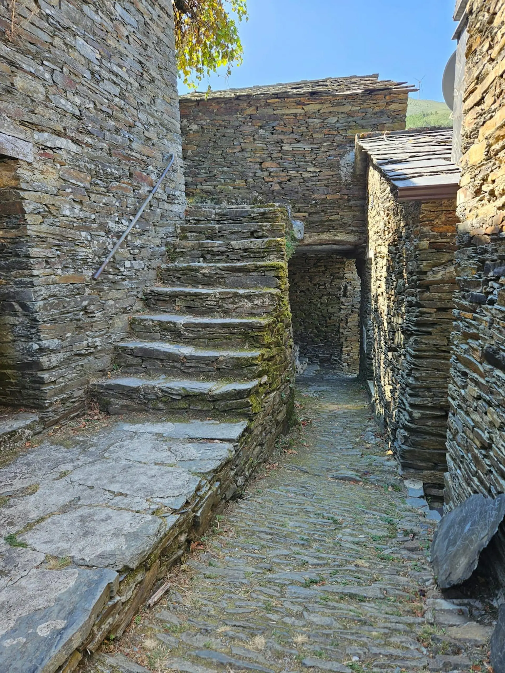 Ancient dry-stone staircase and pathway in a secluded Portuguese hamlet—ideal for off-the-beaten-path green real estate and sustainable slow living.