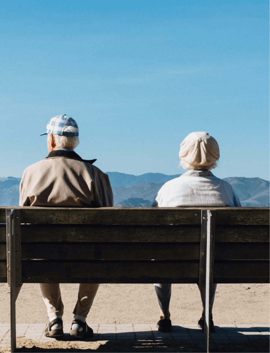 An old woman and a man sitting on the bench