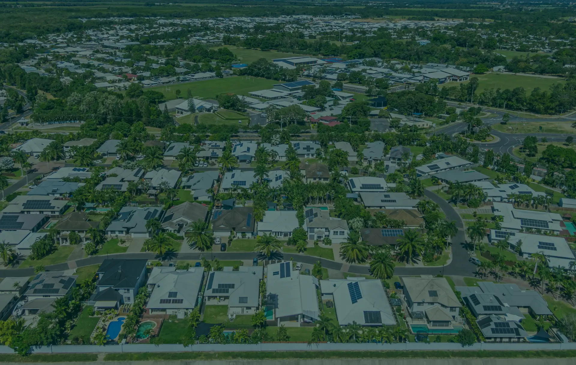 Aerial view of densely packed suburban houses.