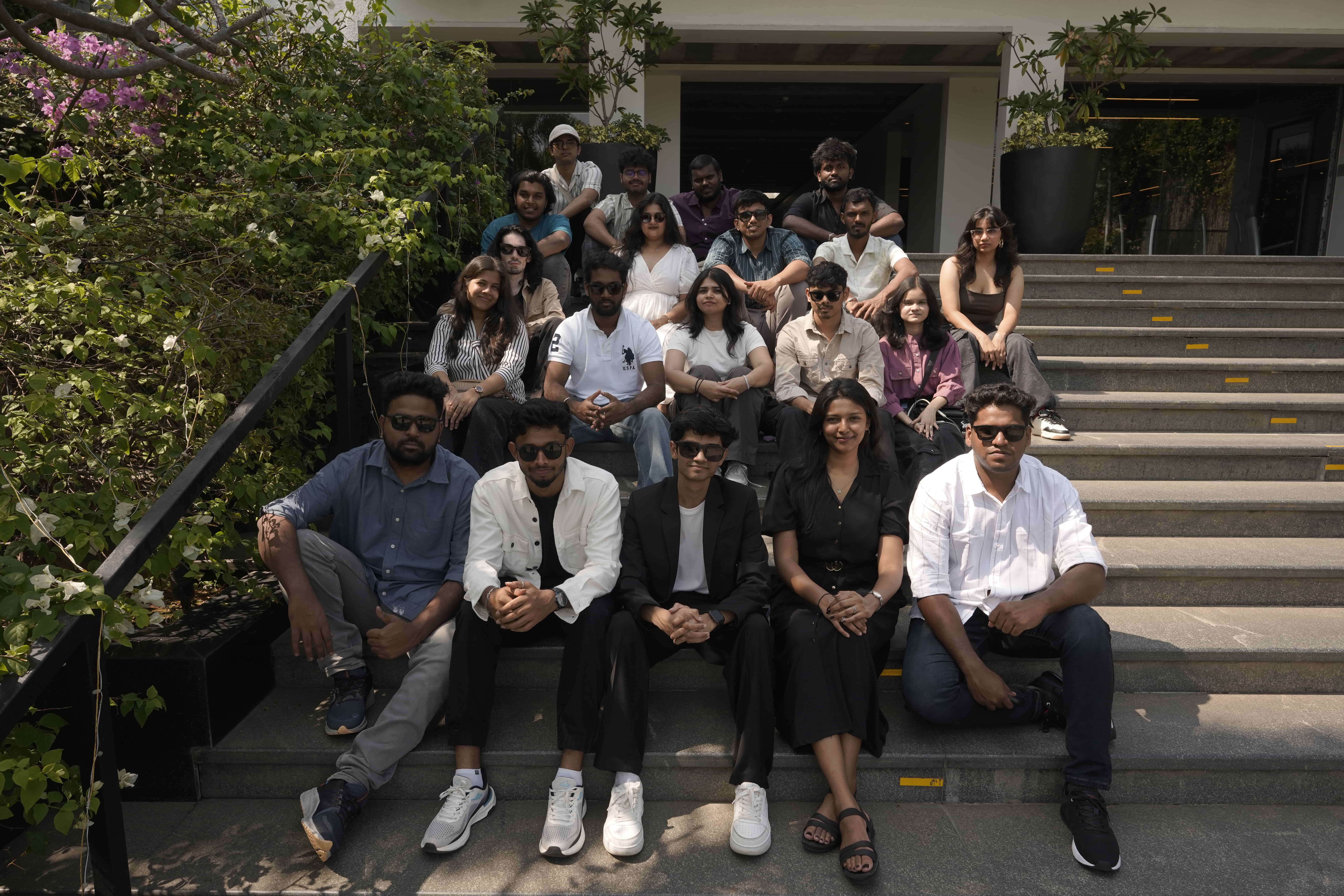 Group of people relaxing outdoors on a field or lawn