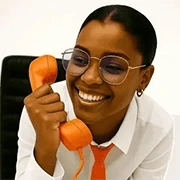 Admin lady answering a phone at workplace