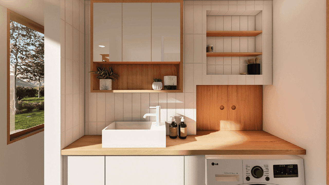 This tiny house bathroom has everything you need in a bathroom. With a slim space-saving vanity with under cupboard storage, in-built wall shelving, space for a washing machine, a standard shower and a compost toilet.