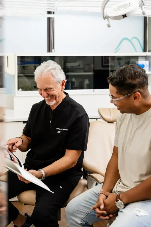 Dr. Cumandra explaining a procedure to a dental patient: : Best dentist in Scarborough, Ontario