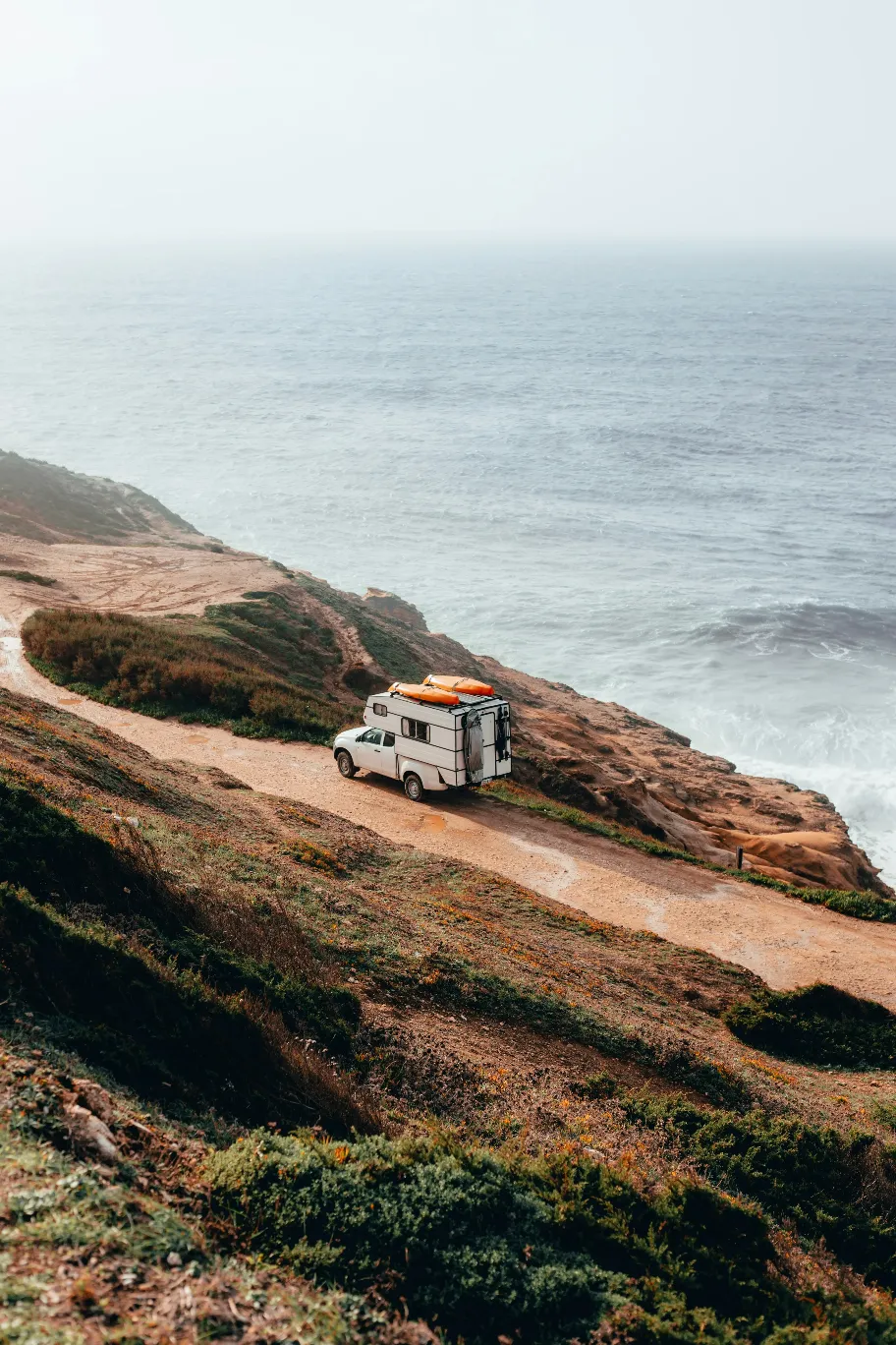camper trailer on cliff near sea
