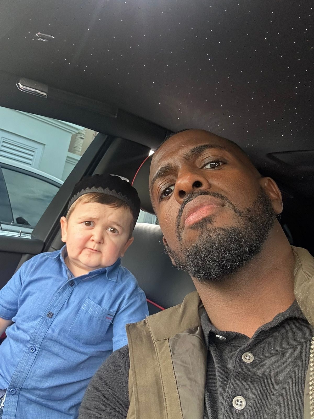 man in green and black camouflage jacket