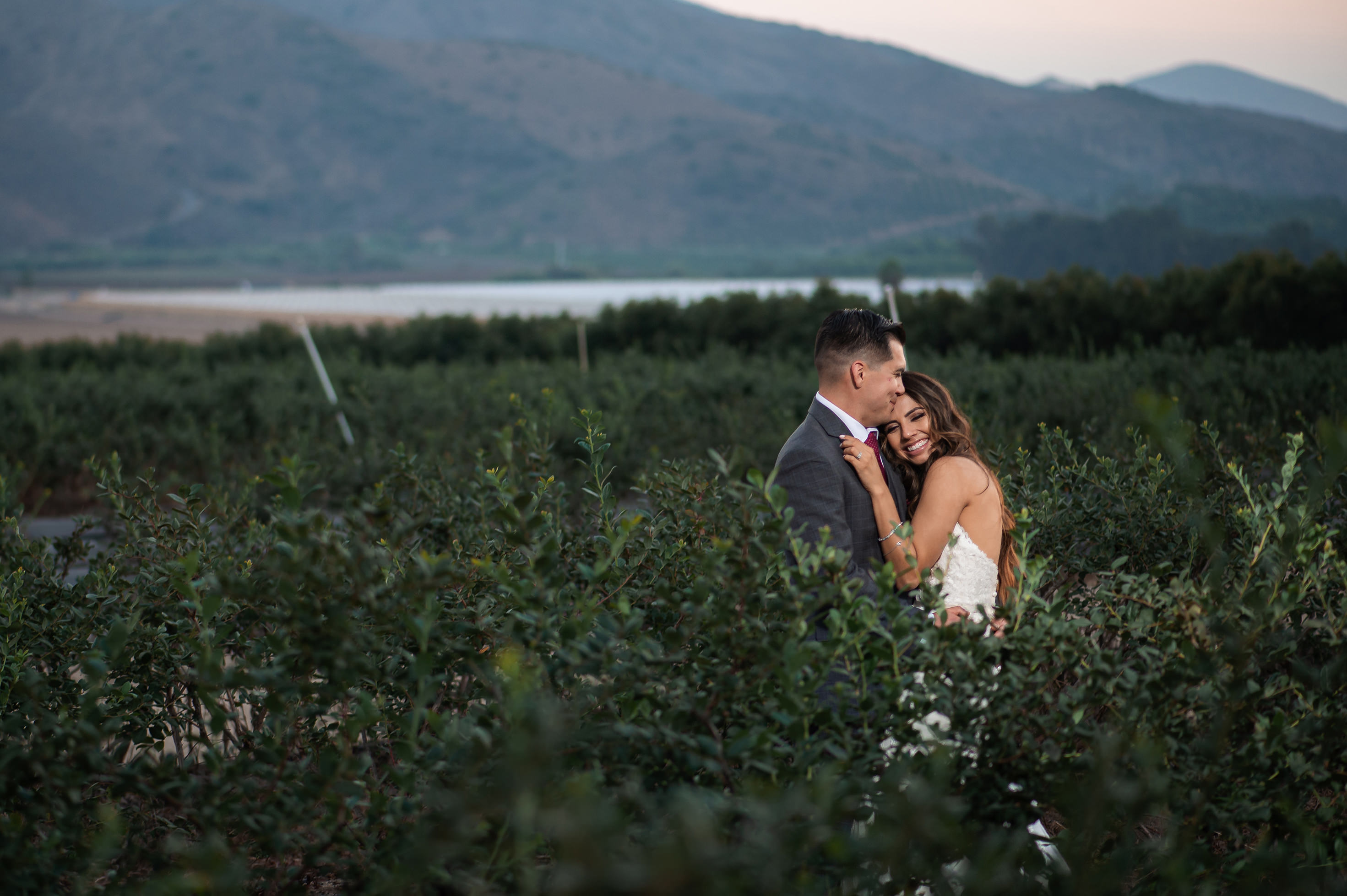 Bride and groom portraits with mountains in the background at Gerry Ranch