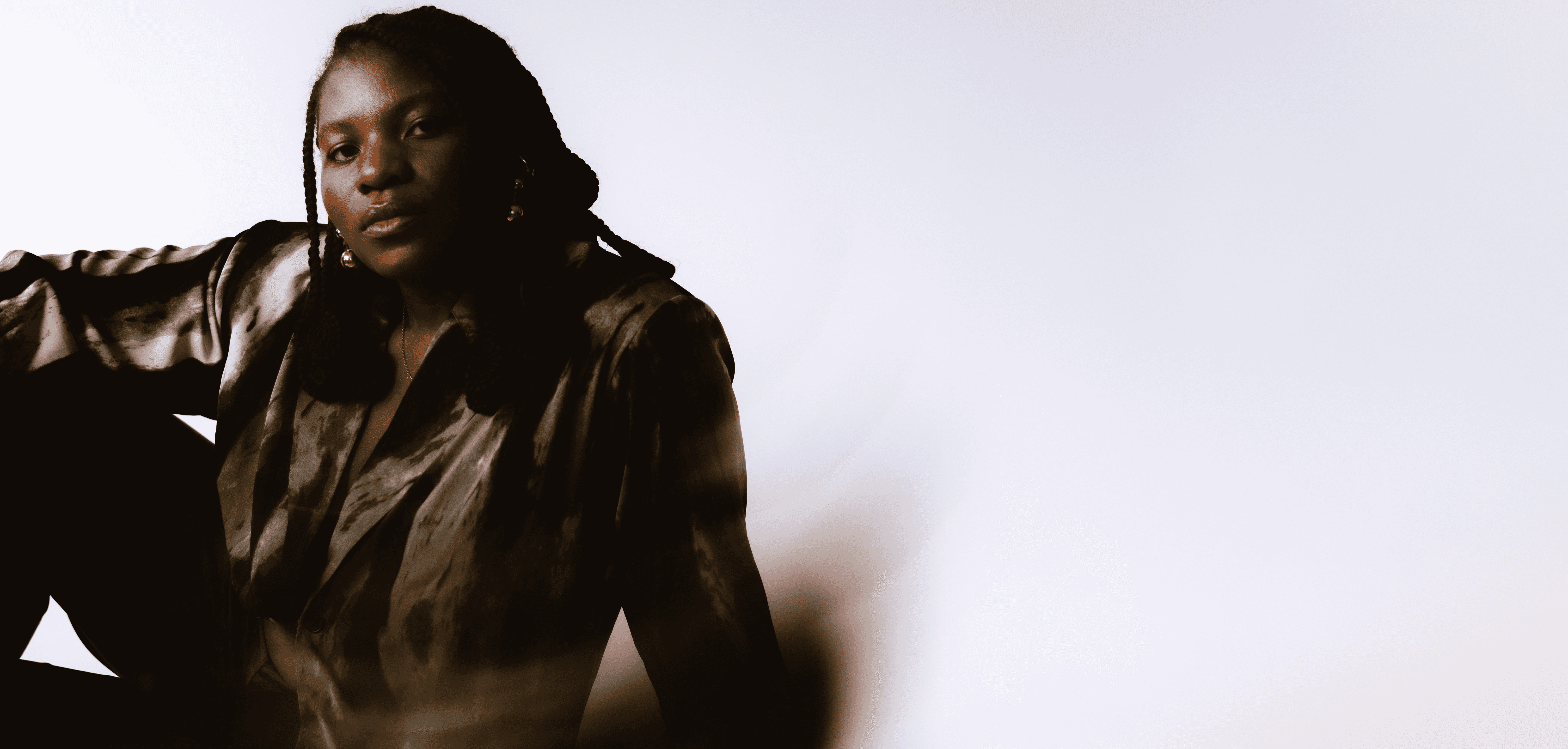 Dali Adekunle Creative Director and Actor in New York photo action headshots sitting bac