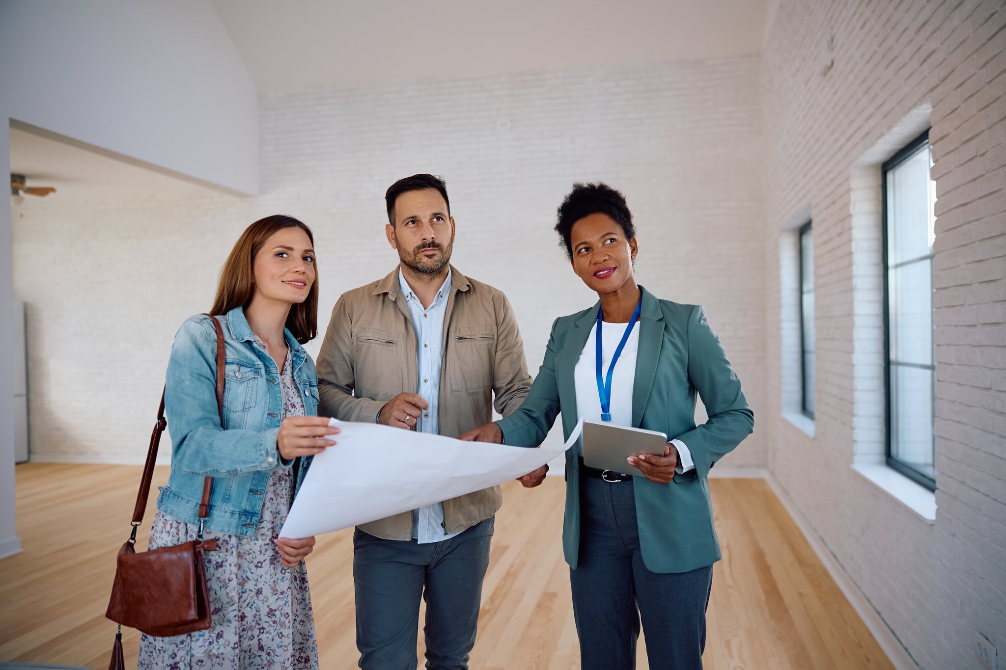 People going over plans for a house.