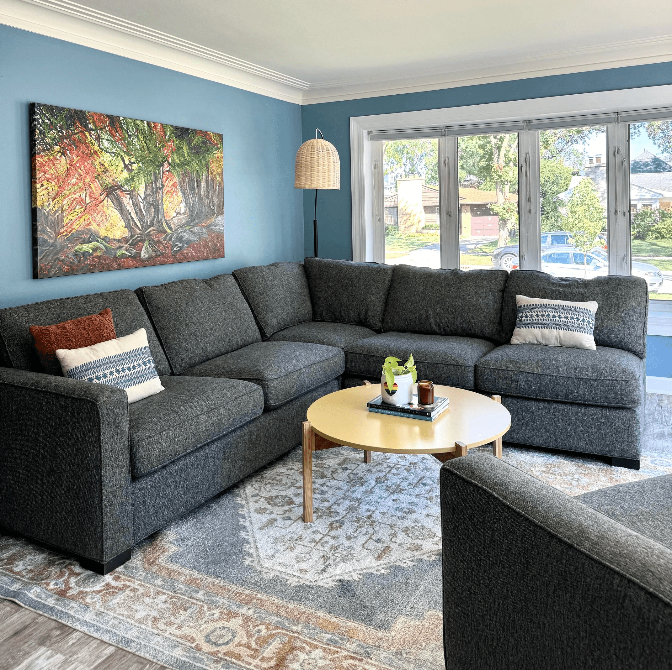 gray sectional living room with art and styled decor