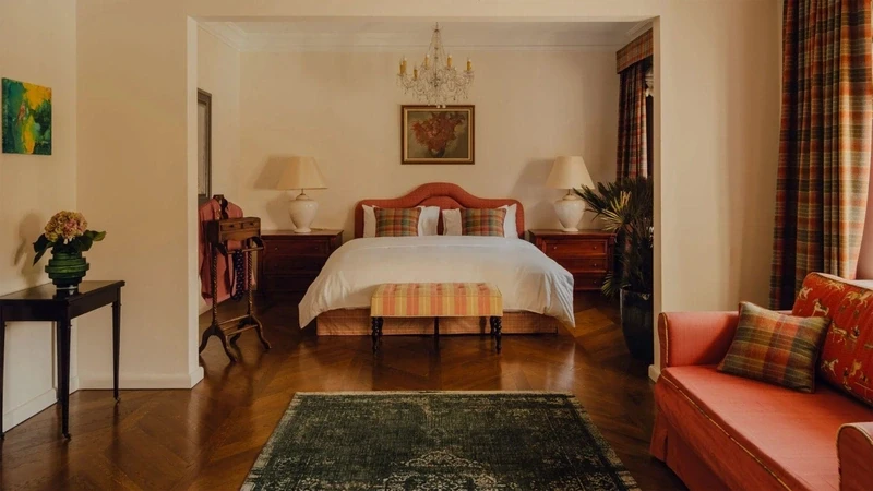 a palace bedroom with a large continental bed