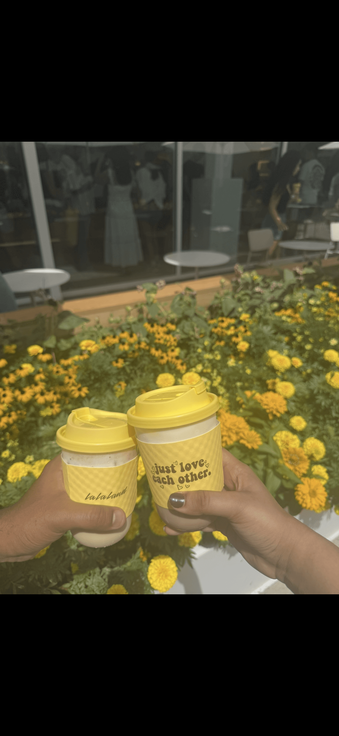 Symmetrical abstract pattern of dark, curved shapes.