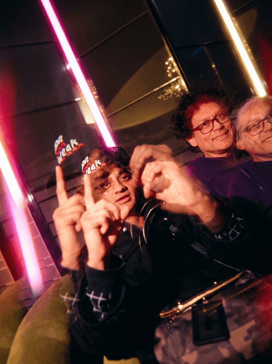 Bride in white dress walking on street, blurred motorcycle passing