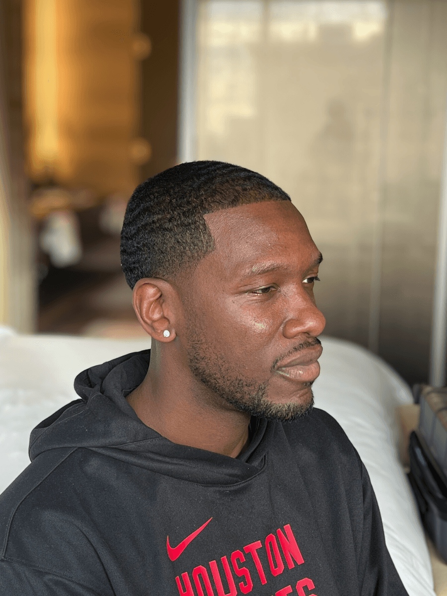 gray sports coupe parking during daytime