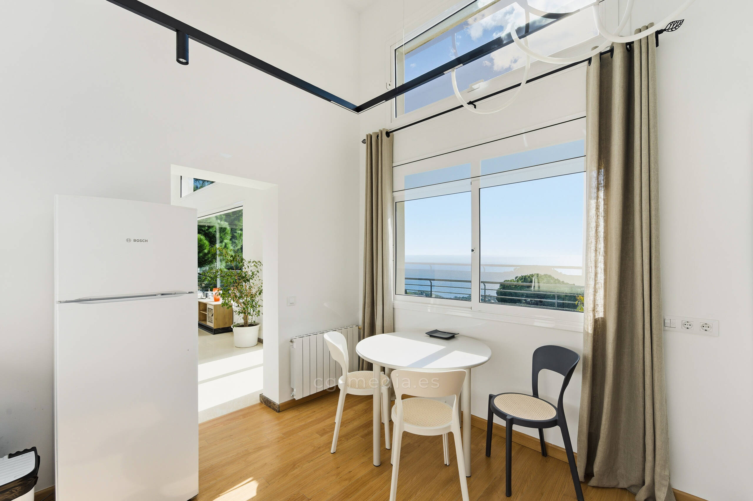 A woman standing in front of a colorful wall