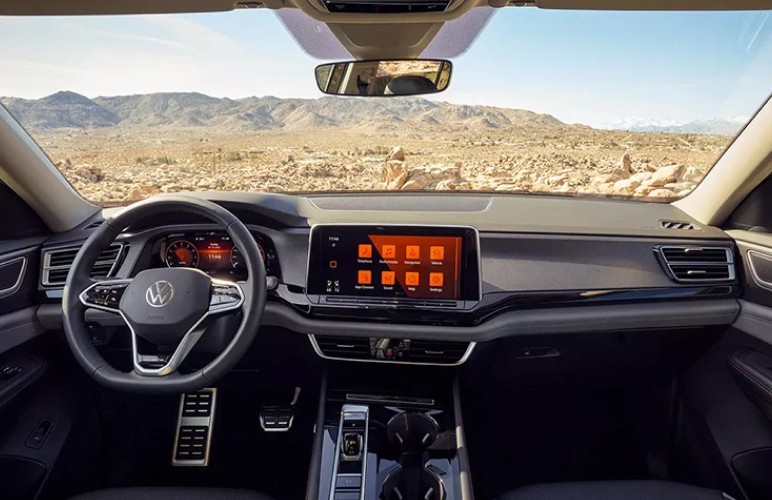 a close up of a steering wheel and dashboard of a car