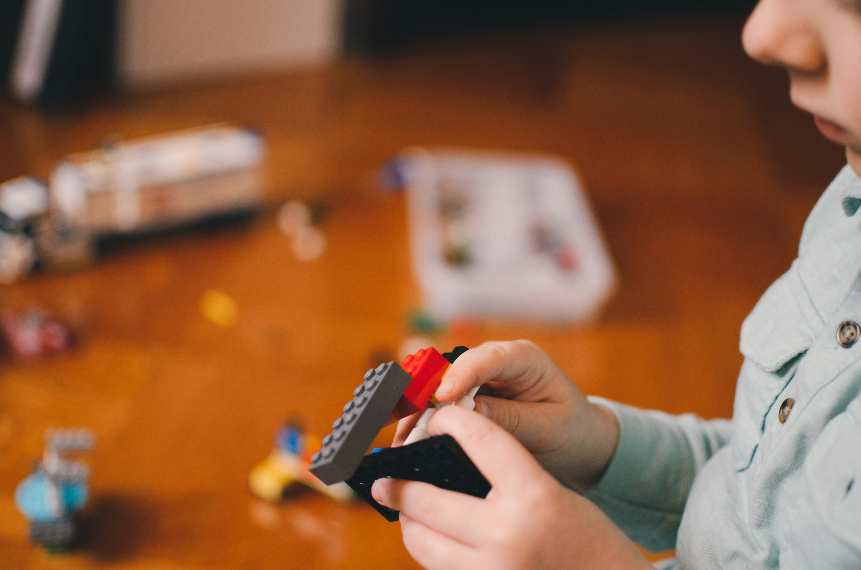 a kid handling a lego