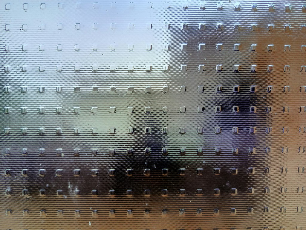 a close up of a window with rain drops