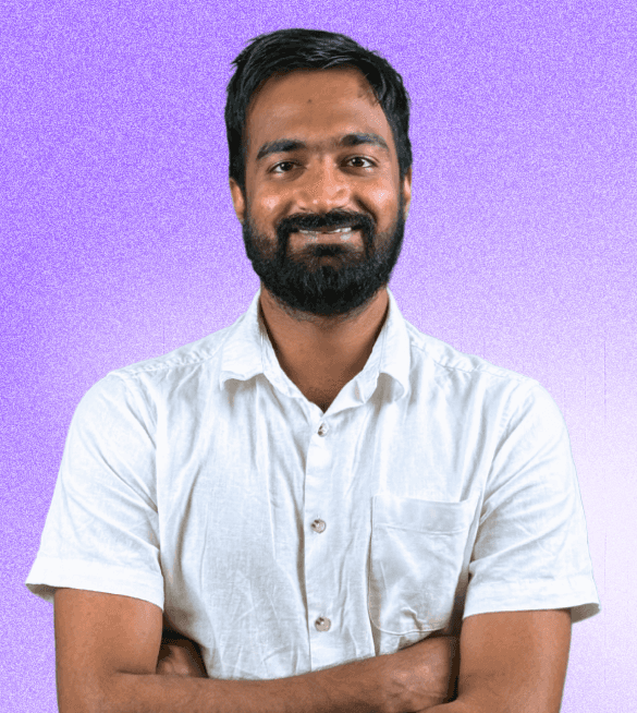 Portrait of Pankaj Gupta, Co-founder & CTO, wearing a white shirt with arms crossed, smiling confidently against a light purple gradient background.