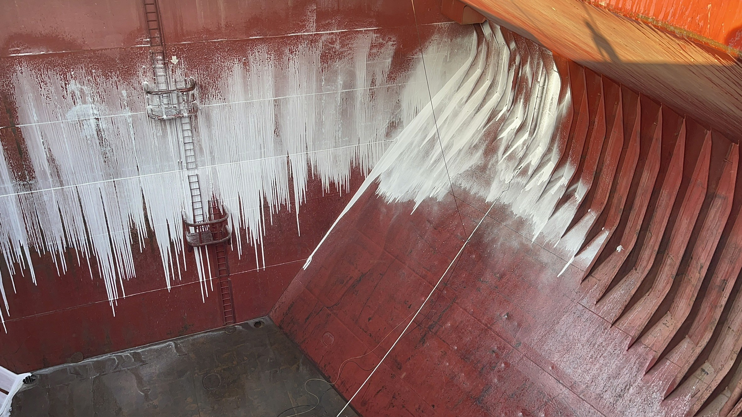 Clean, dry cargo hold prepared for grain / sugar readiness, with de-rusting and touch-up coating completed where required.