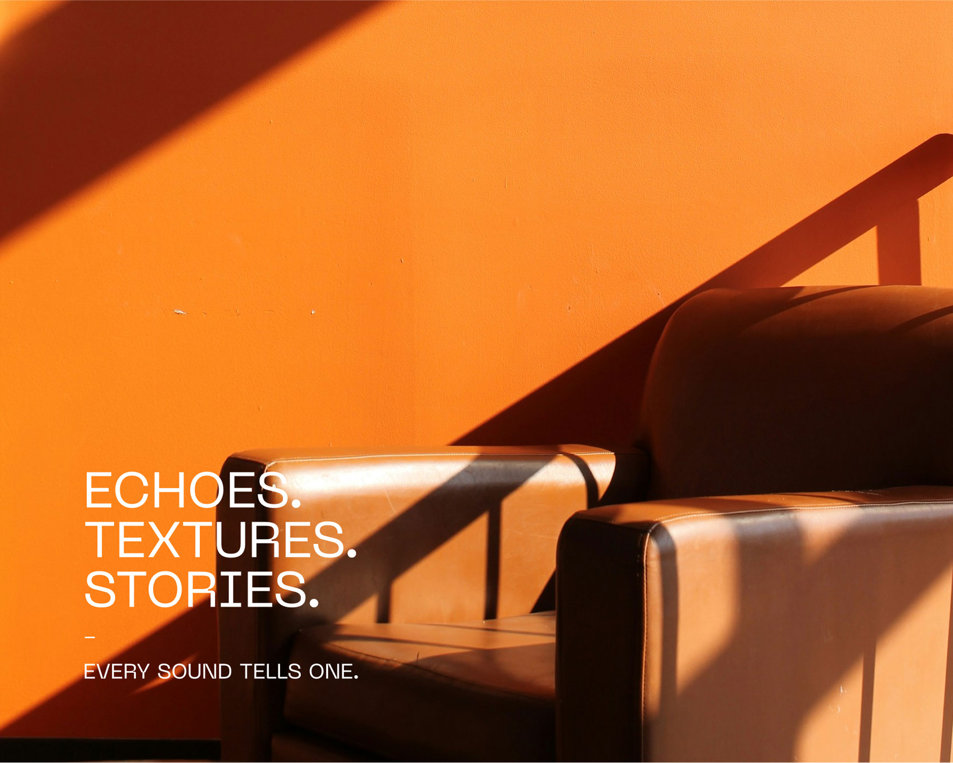 A cozy leather armchair is bathed in warm sunlight against an orange wall, accompanied by text that reads "Echoes. Textures. Stories. Every sound tells one," with a shadow adding depth and contrast to the scene.