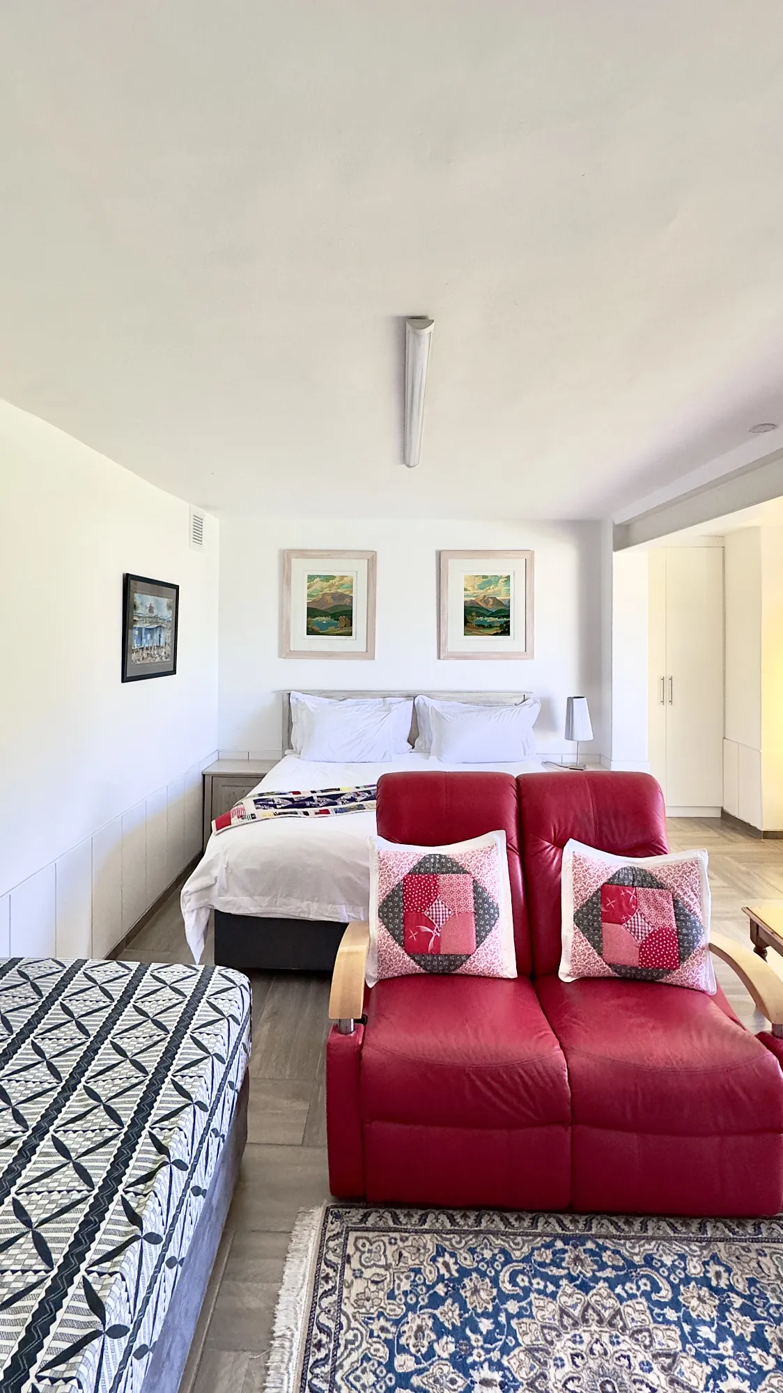 The bed, two-seater couch and extra single bed in our Take 5 room.