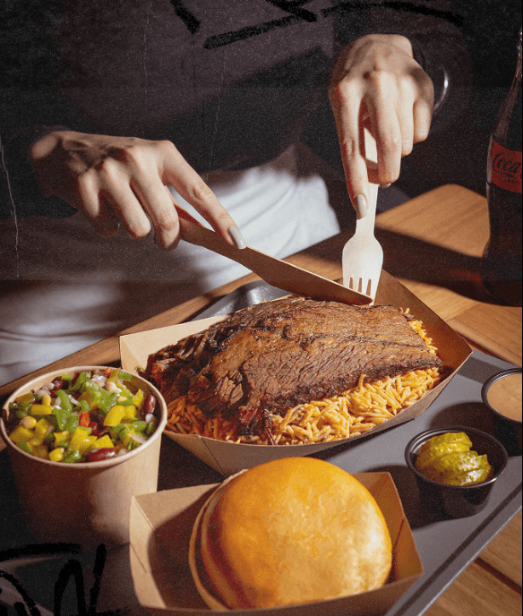Person enjoying a meal of halal foods.