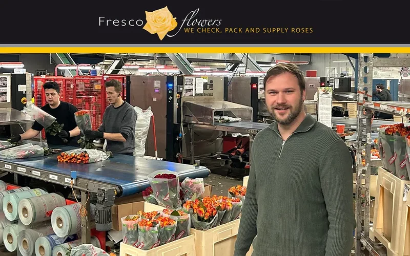 Rico Telleman of Fresco Flowers standing in front of a flower packing line