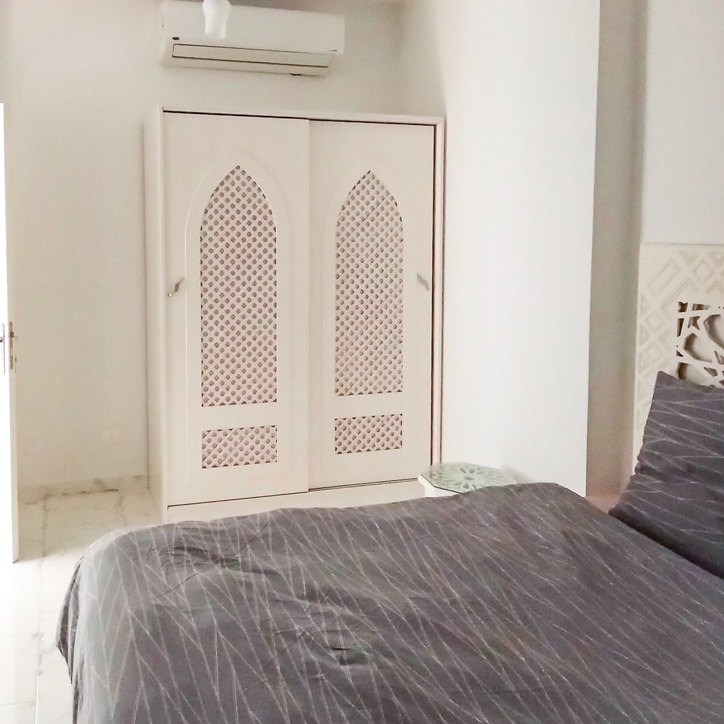 white and brown concrete building under blue sky during daytime