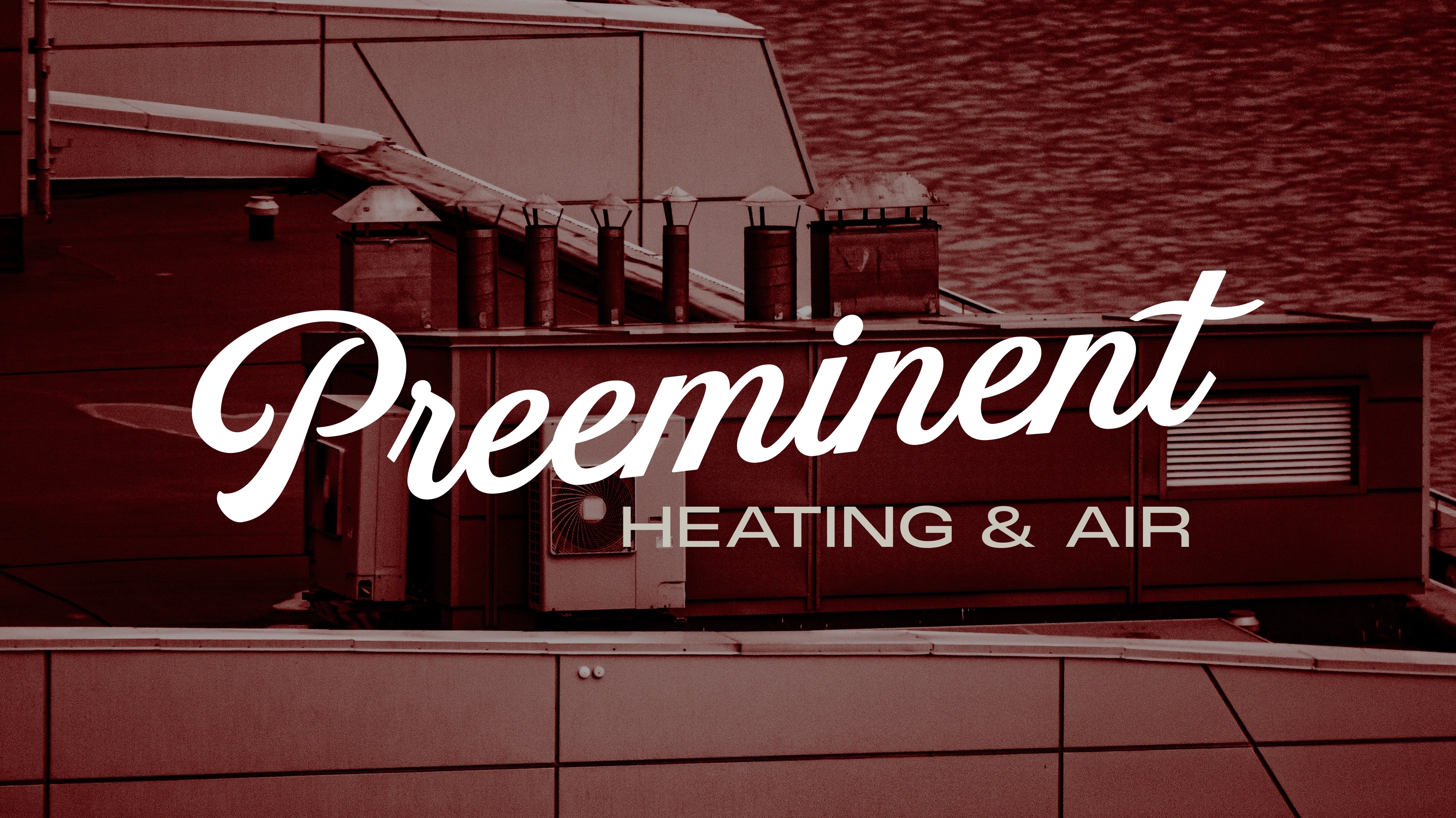Preeminent Heating & Air script logo over a red-toned rooftop HVAC unit