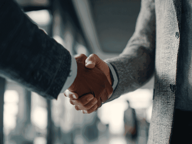 Two business professionals shaking hands