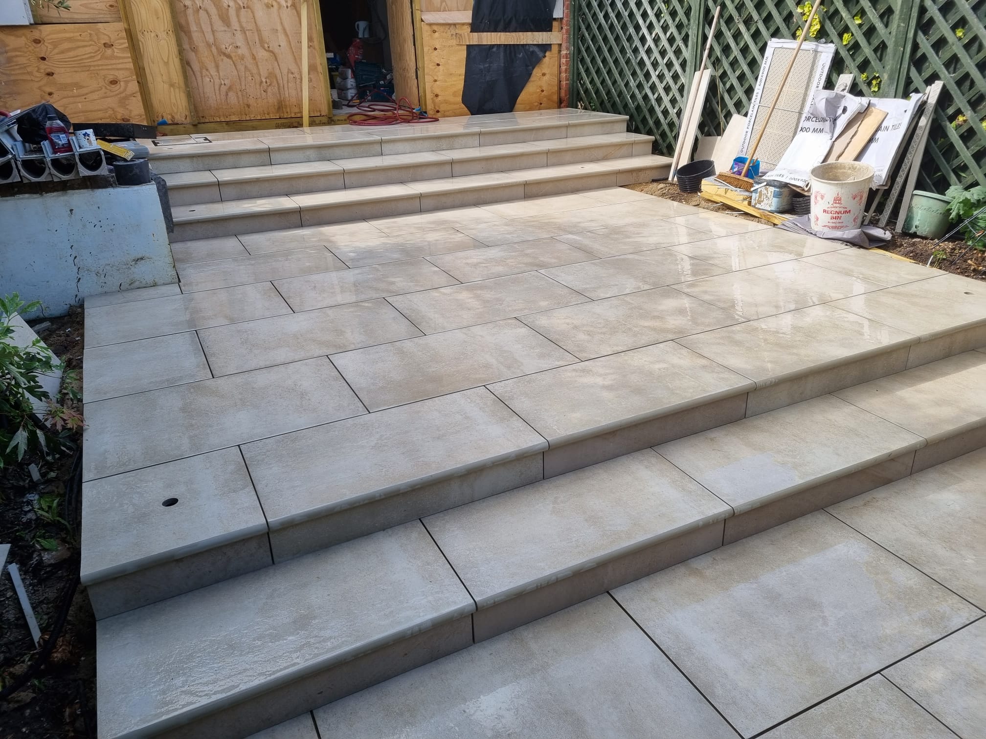 A red fire hydrant sitting on top of a brick walkway