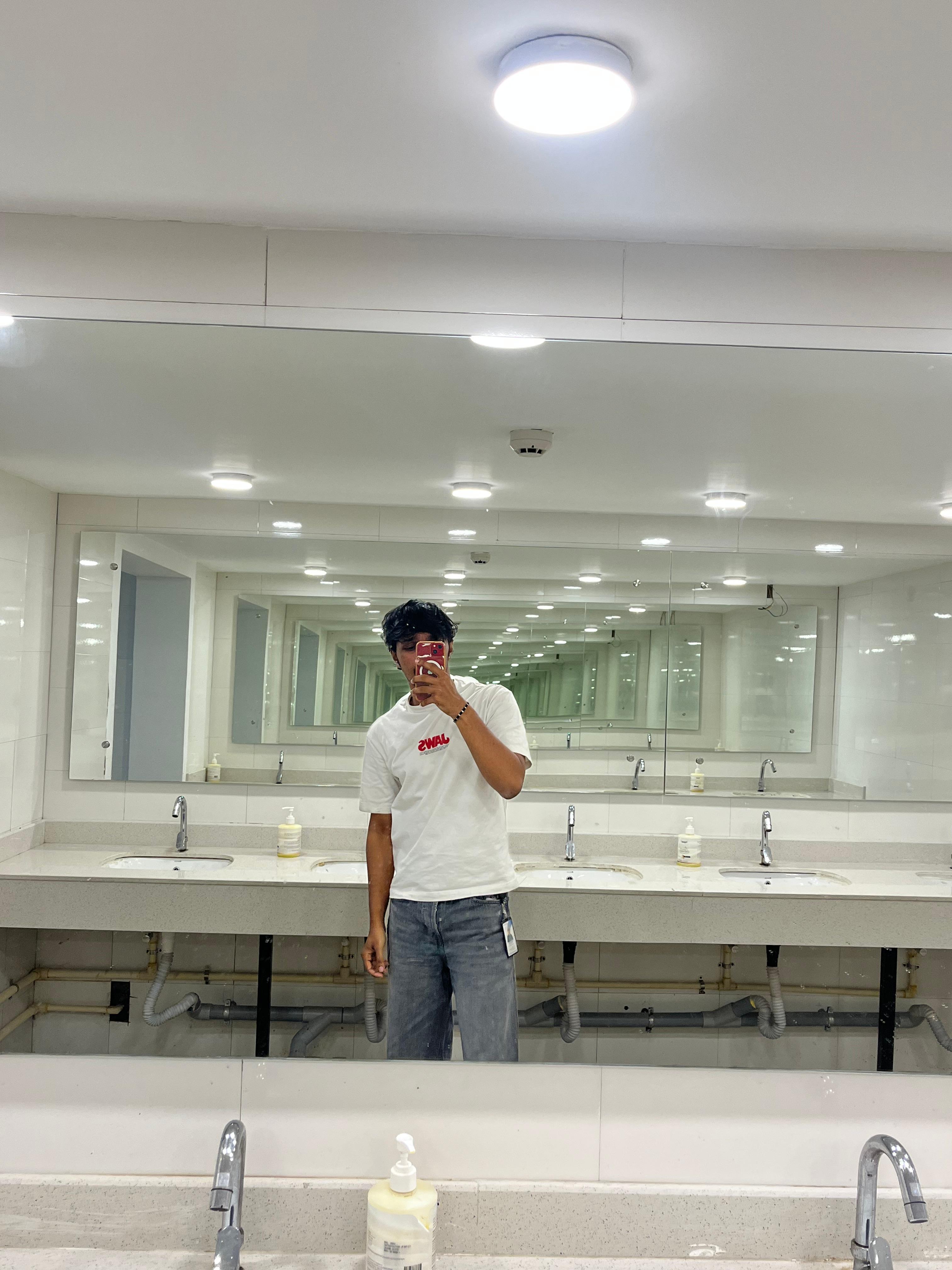 Mirror photograph in a tiled corridor