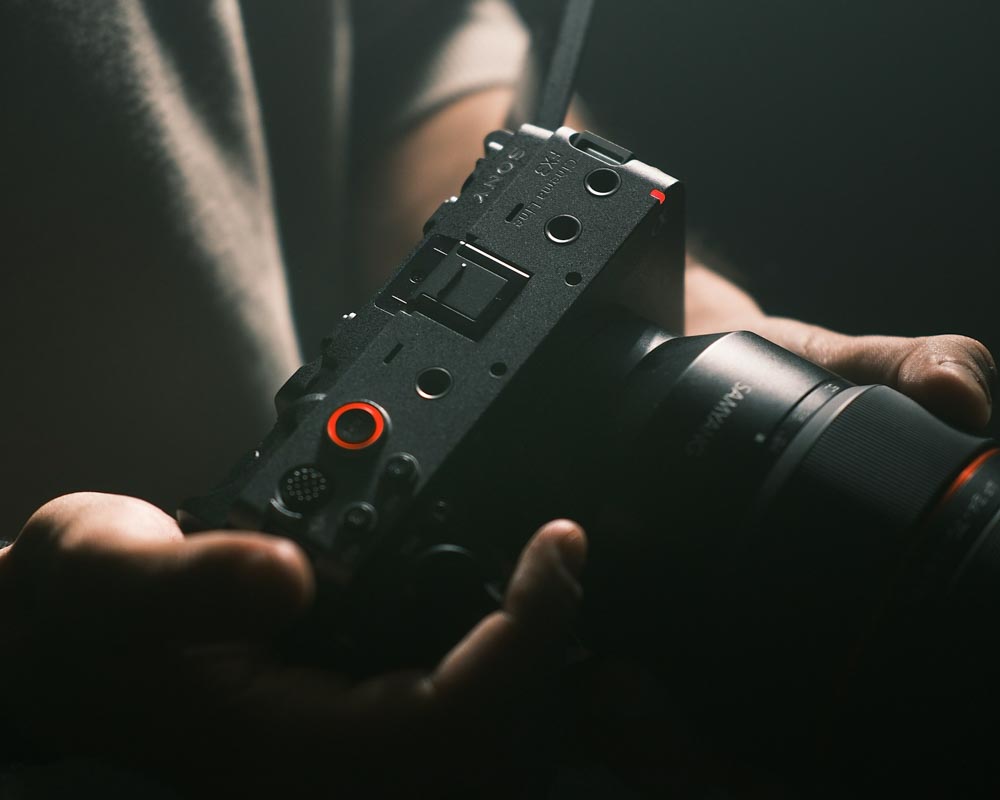 A person holding a camera in their hands