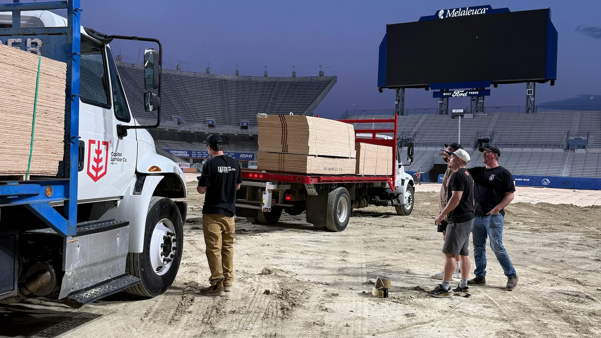 Capital Lumber employees delivery of plywood to Boise State University