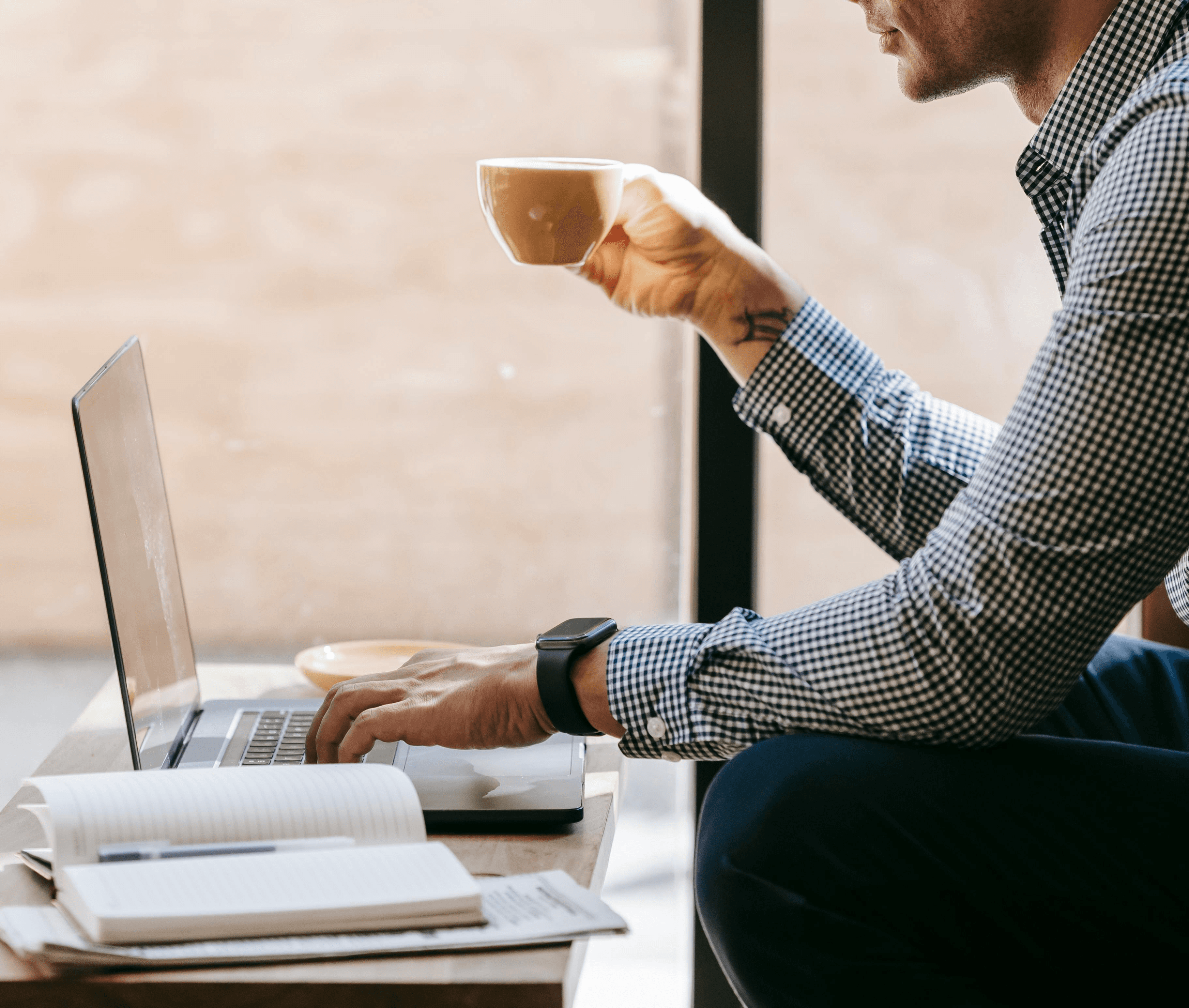 a laptop computer sitting on top of a wooden desk