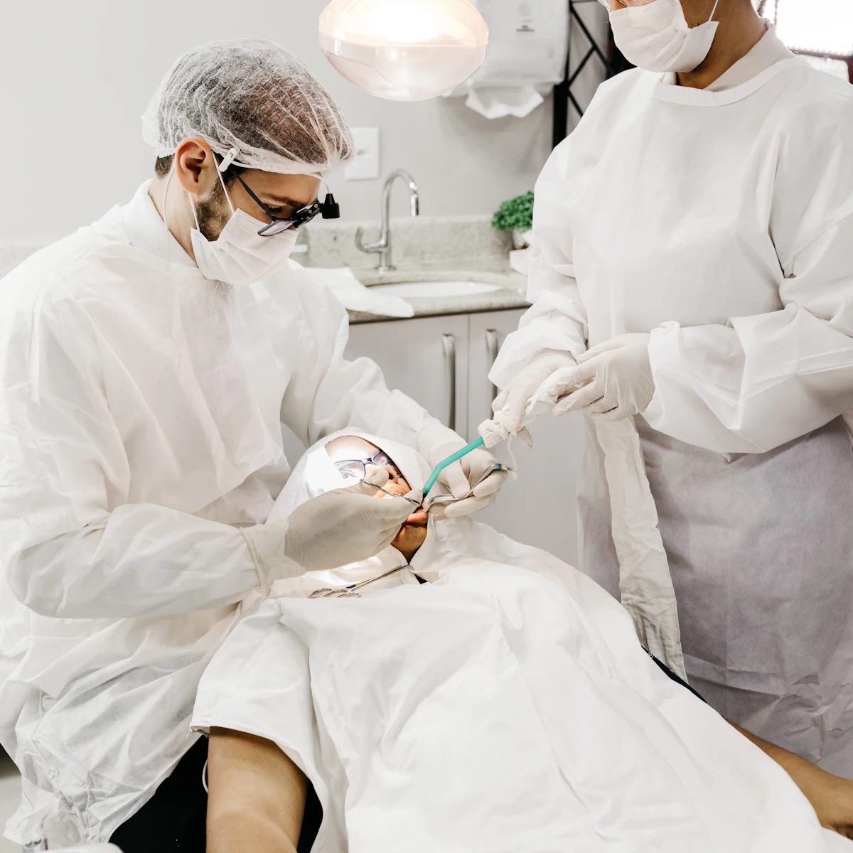 Smiling dentist welcoming a patient