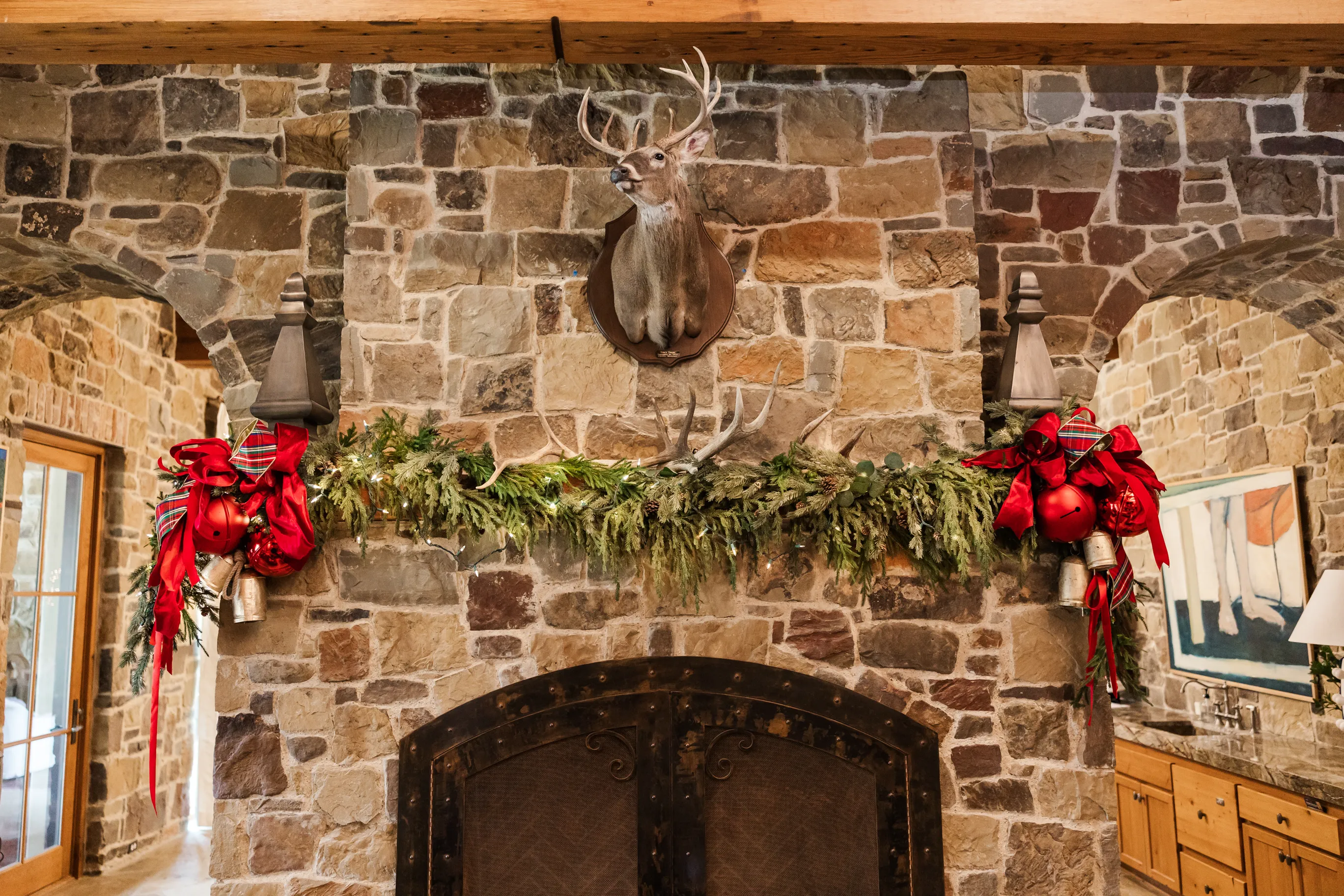 Luxury table setting by Sarah Overall Events with pink embroidered napkins, gold-rimmed plates, floral arrangements, and personalized menus in Shreveport.