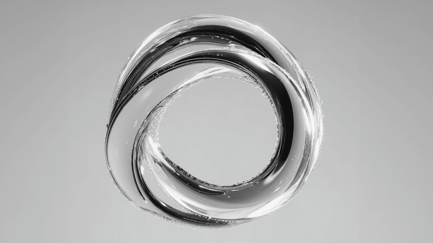 Two colleagues collaborating over paperwork at an office desk, with plants in the background.