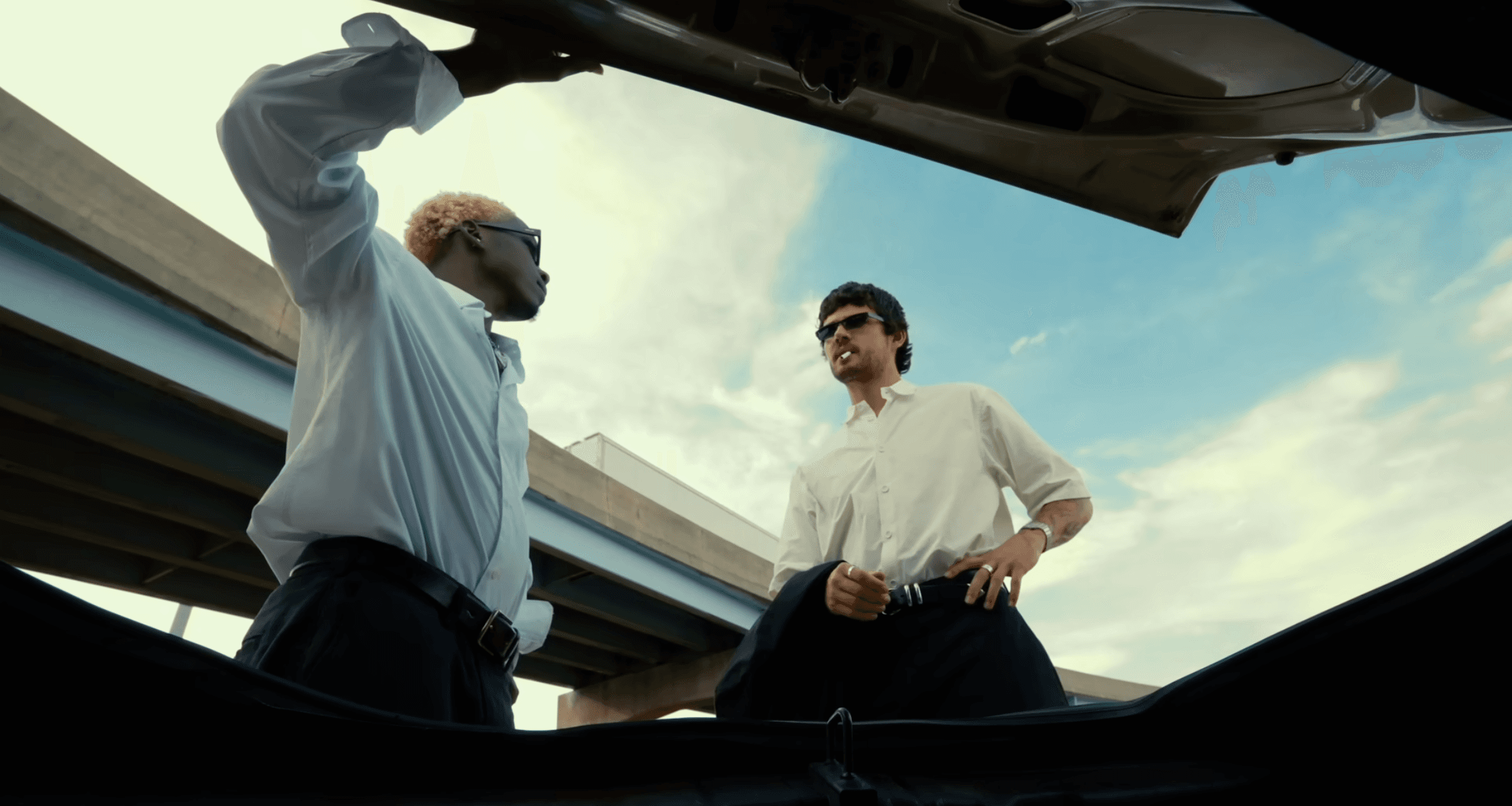 A plane flying in the sky at sunset